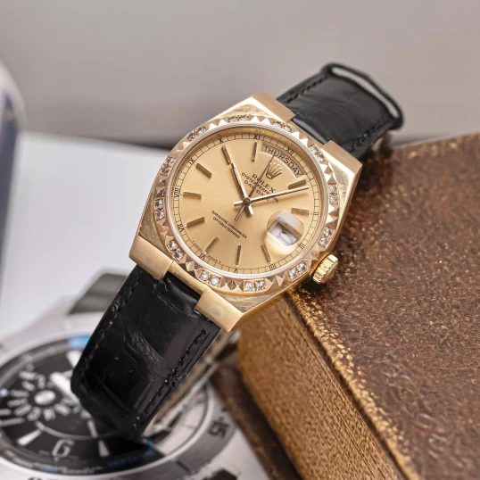 Rolex Oysterquartz Day-Date 19018 Yellow Gold Champagne Dial Diamond Bezel