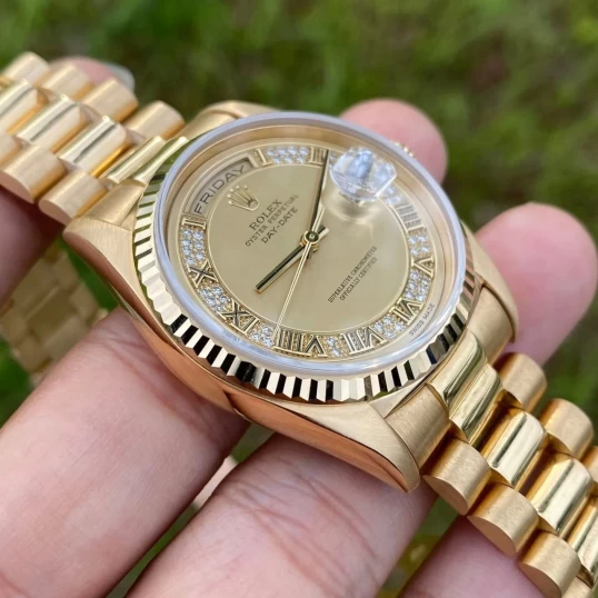 Rolex Oyster Perpetual Day-Date 36mm 18K Yellow Gold Champagne Roman Diamond Dial – Ref. 18238